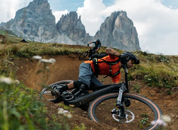 Lifestyle shot of a cyclist wearing a helmet on mountain bike