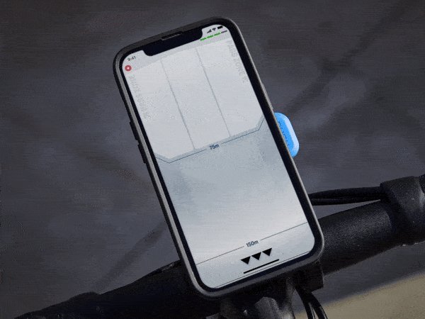 Smartphone mounted on a bike showing the Trek CarBack radar app