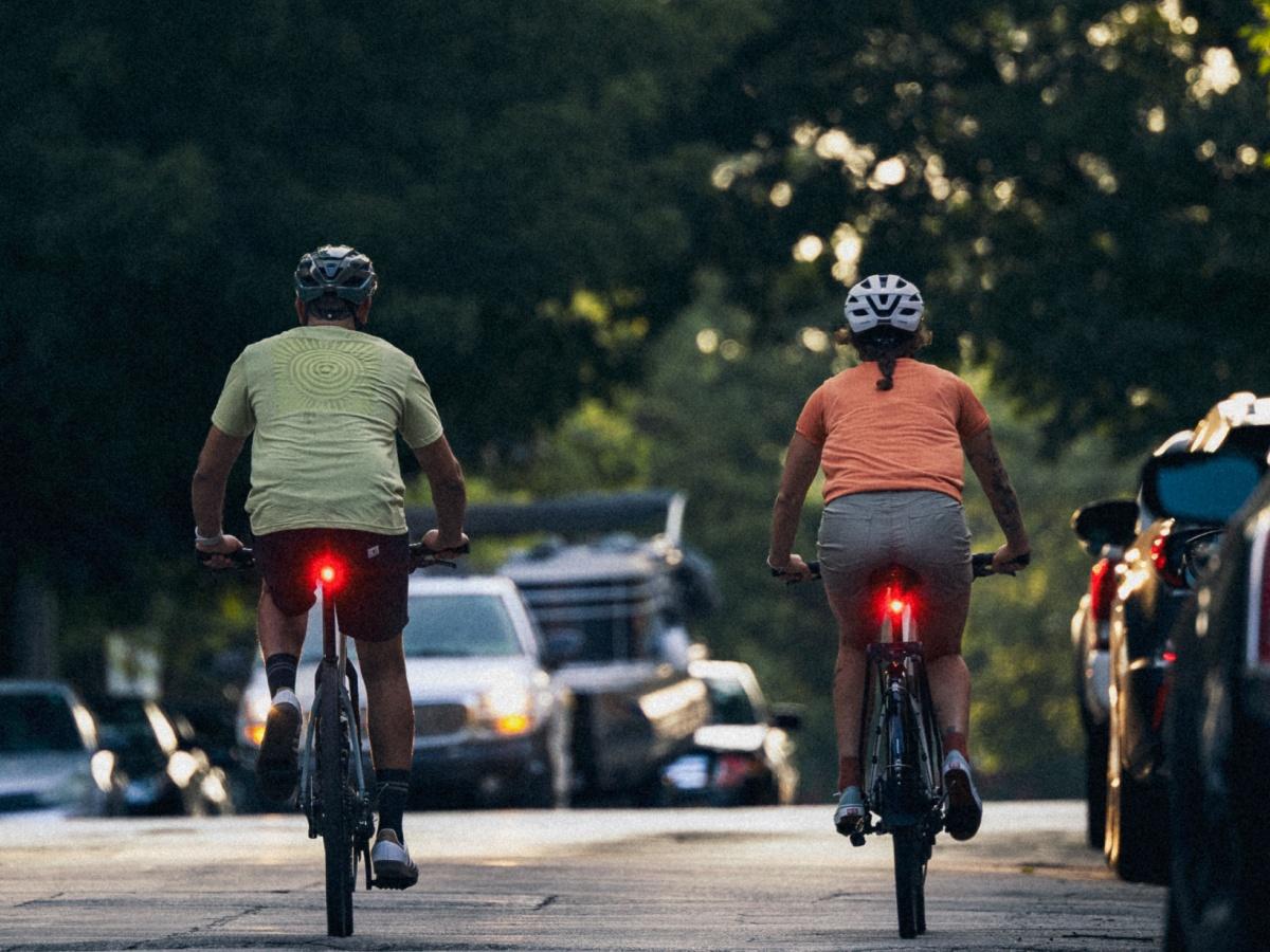 Cyclists riding with flashing tail lights, 240% more visible