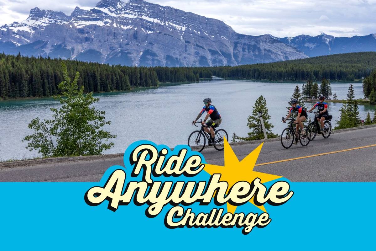 Three cyclists mountain lake road challenge ride anywhere