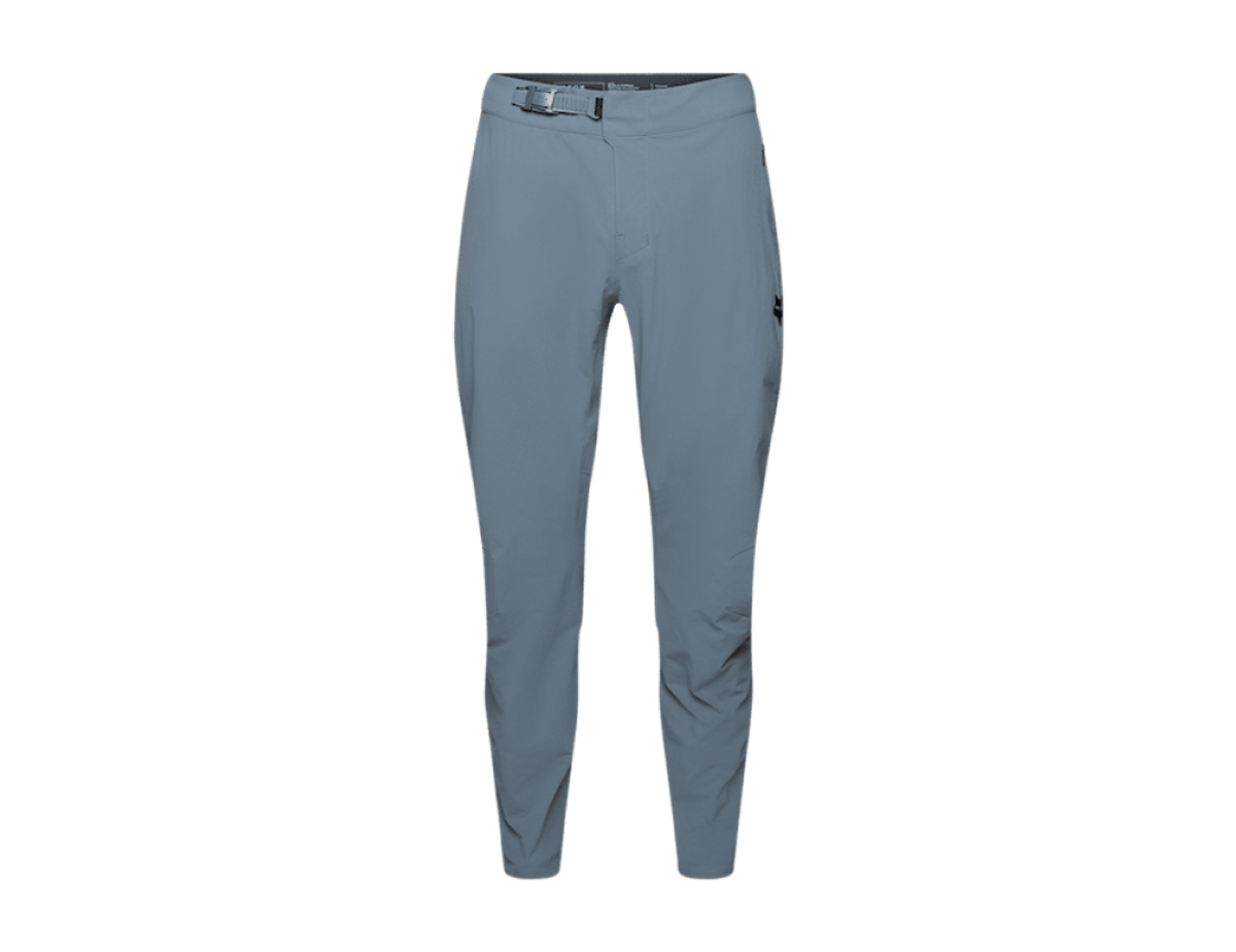 Fox Racing x Trek Ranger mountain bike pants in slate blue-grey, with a belted adjustable waist, a zippered thigh pocket and a tapered leg.