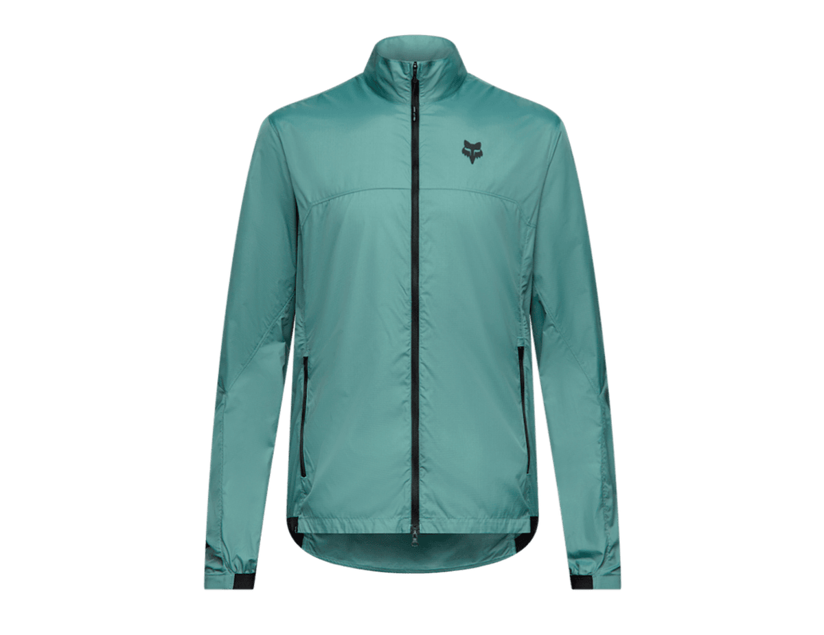 Fox Racing Ranger wind cycling jacket in light teal blue, with a black full-length zipper, elasticated cuffs and a Fox Racing logo on the left chest.