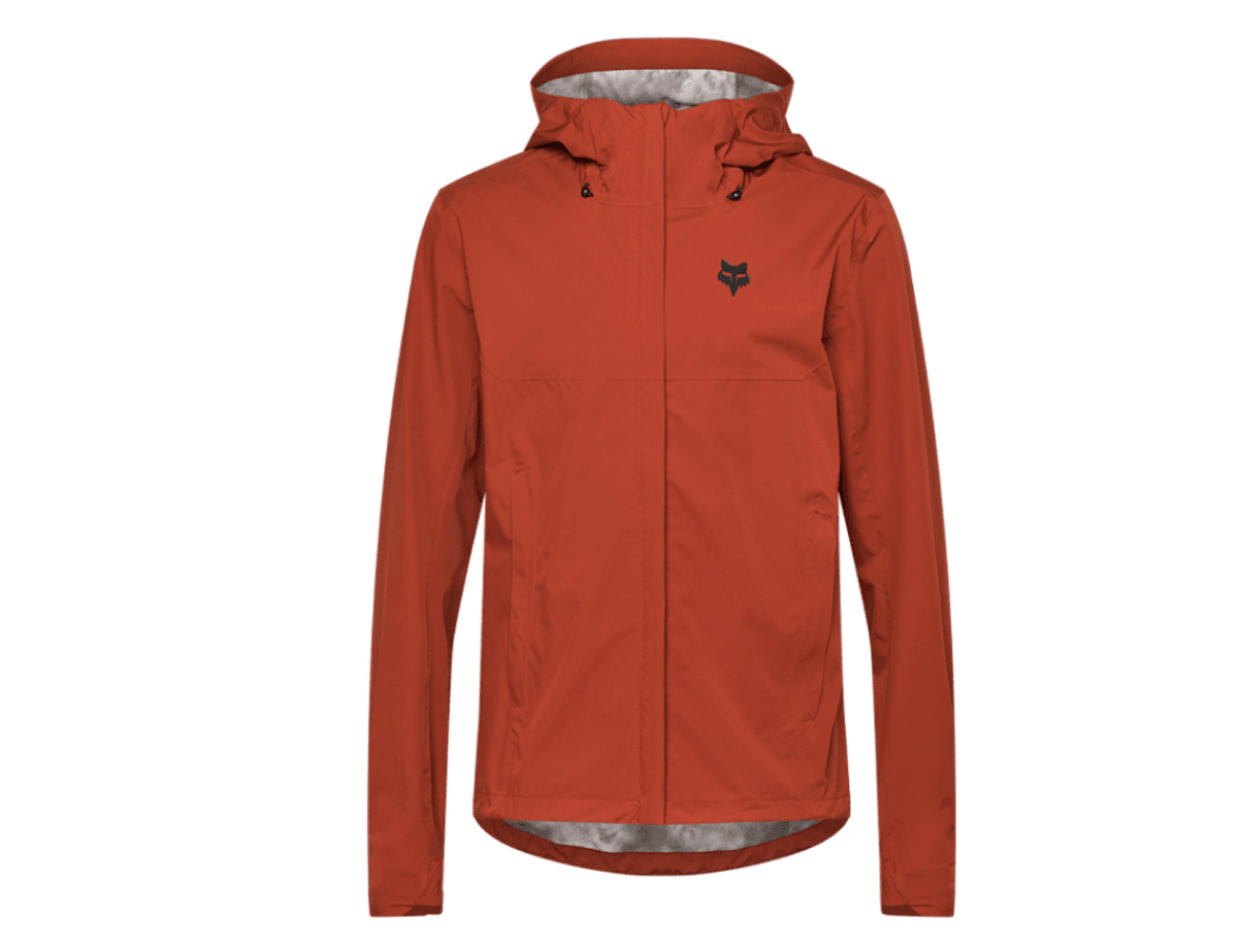 Fox Racing Ranger 2.5L water cycling jacket in rust orange, a hooded waterproof shell with a full-length zipper and a Fox Racing logo on the chest.