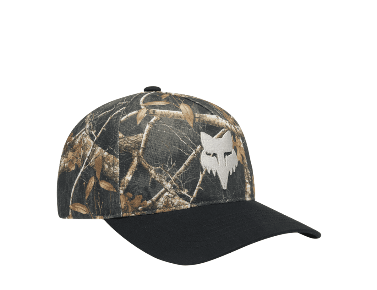 Fox Racing Realtree Subframe hat, a branch-and-leaf camouflage cap with a black brim and a white embroidered Fox Racing logo on the front.