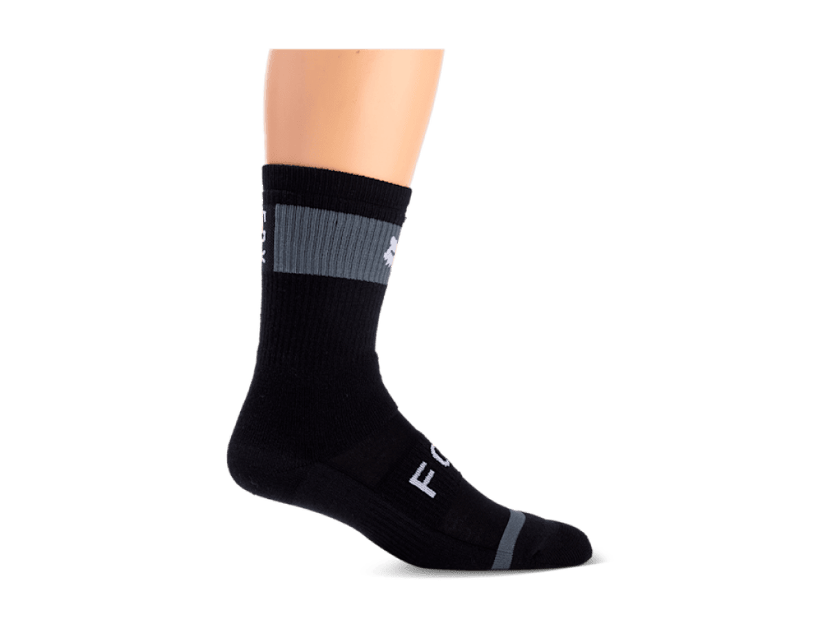 Fox Racing 8-inch Defend winter sock in black, with a grey cuff panel and white Fox Racing lettering along the foot.