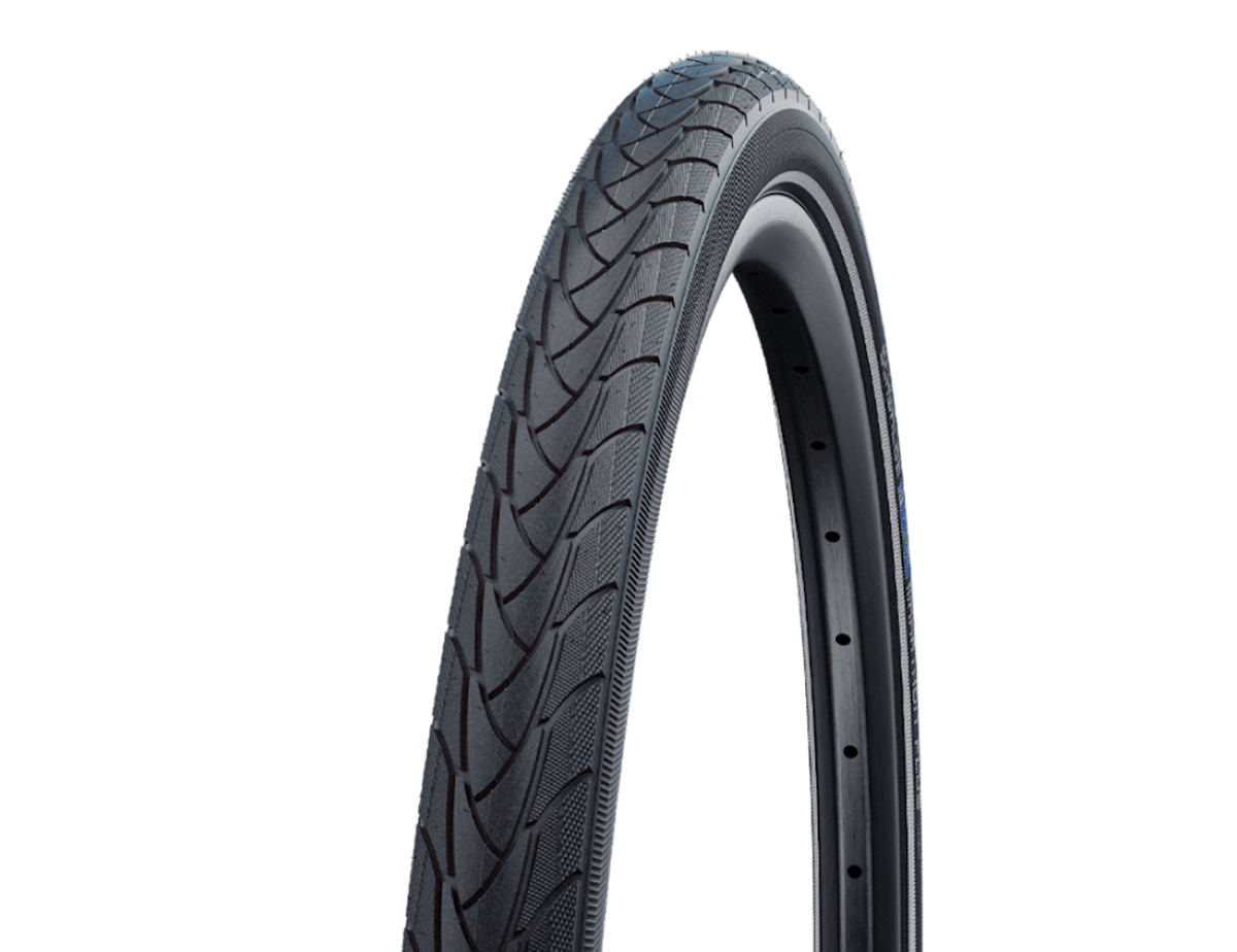 The Schwalbe Marathon Plus Tire, a black hybrid tire with a diagonal tread pattern.
