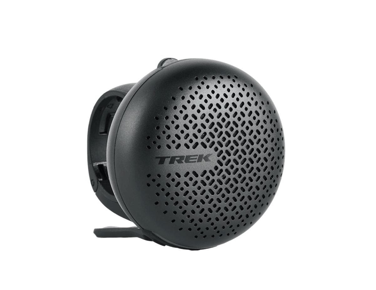 The Trek BellBeats Digital Bike Bell and Speaker, a round black speaker with a handlebar mount.