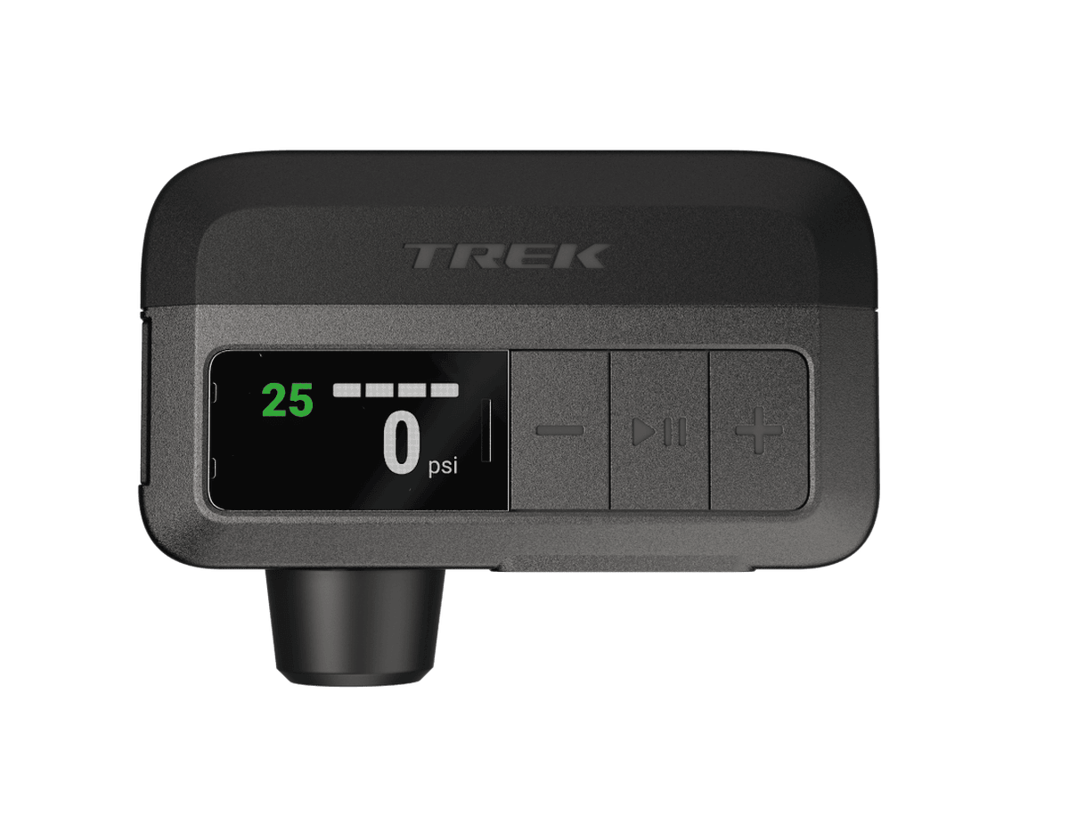 The Trek Air Rush Electric Pump, a compact black electric pump with a digital pressure display.