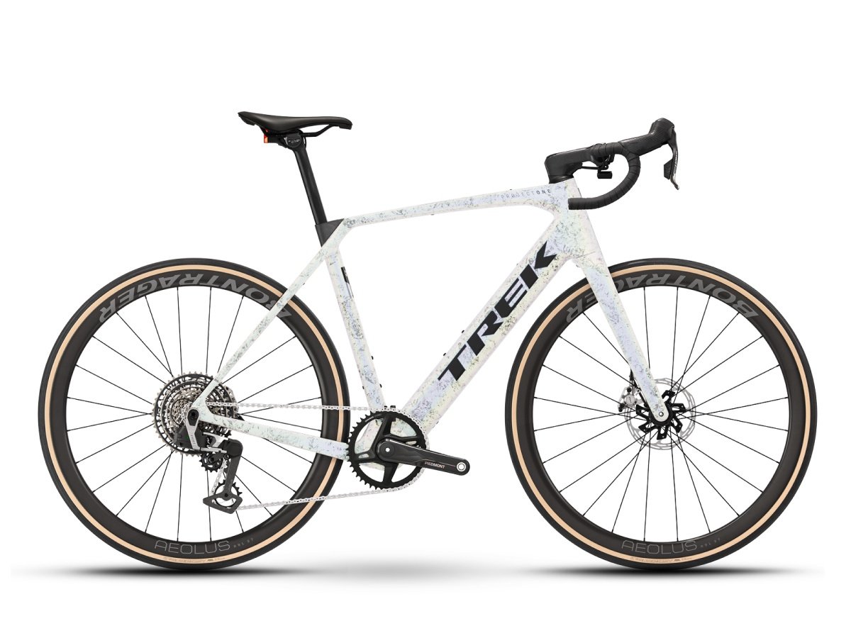 Trek Domane+ SL electric road bike in white with tan sidewall tires