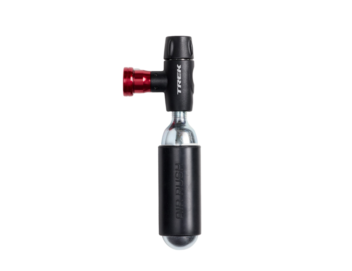 Trek Air Rush Elite CO2 inflater with a red head and a CO2 cartridge